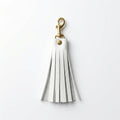 White Italian pebble leather tassel keychain keyring with brass hardware